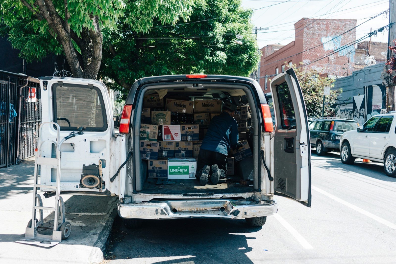 Cargo van with rear doors open showing organized storage